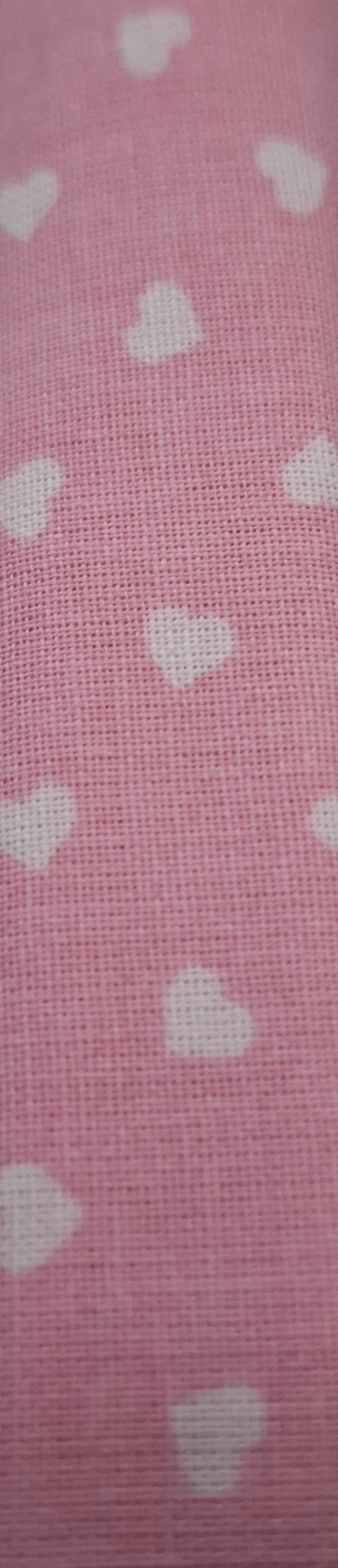 Tessuto rosa cuori bianchi